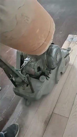 wood floor sanding activity using a heavy duty sander for a smooth and even surface finish