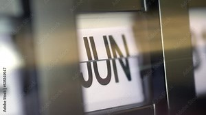 A flip clock changing the month from January to December