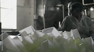 A lot of plastic food containers are produced at the factory. Small Plastic containers are used for the storage of the dairy food. Multiple plastic food containers are collected in the production room