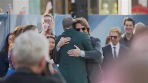 Tom Cruise shows up for Brad Pitt’s ‘F1’ premiere