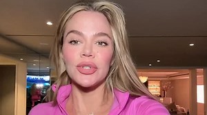 Khloe Kardashian flashes her abs while during a morning workout