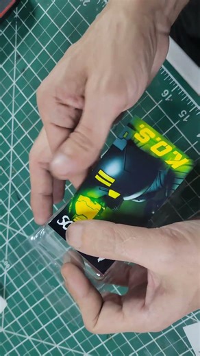 Hand-labeling every K.O.S blister pack — no factories, no shortcuts.Just raw independent toy making