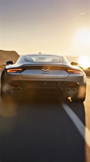 Silver Aston Martin running at full speed #car