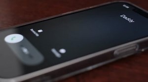 Incoming call screen animation with Accept and Reject options on a black background. Dad is calling