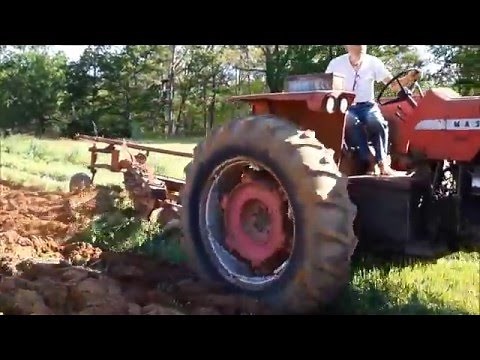 Plowing with 4 bottom semi mounted plow on MF 1080