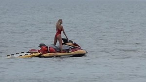 Kelly Rohrbach and Dwayne Johnson jet ski on Baywatch set