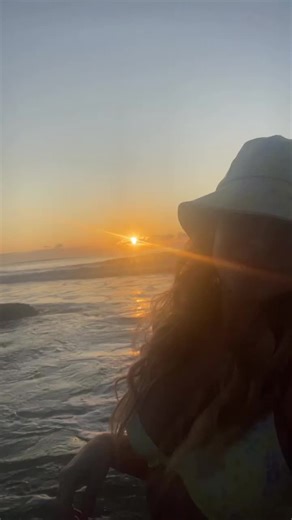 Beach Sunset Bliss: Happy Woman Enjoys Nature