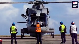 Ever need help parking? Here engineers with 824 Naval Air Squadron, the Merlin training unit, safely marshal one of their helicopters from a training sortie at the airfield at RNAS Culdrose this week. Maneuvering aircraft, as well as maintaining them, is all part of the job. Up close, you can also see the true size of these powerful Merlin helicopters. | Royal Naval Air Station Culdrose