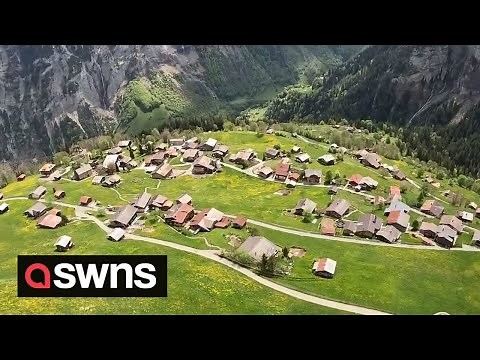 First-time paraglider captures STUNNING footage of historic Swiss village | SWNS
