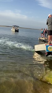 How to release fish on a steep slippery ramp . Tow straps and 3 trucks . | Bass Champs Inc.