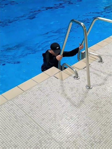 Swimming with clothes in pool