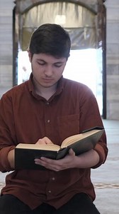 Download Muslim man reading the quran for free