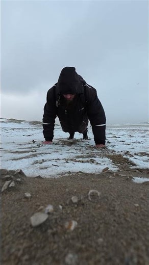 Push ups with a backpack on, in the winter and on the beach
