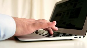 Download Businessman working with laptop and waiting in office, businessman using body language for boring works in office, selective focus for free