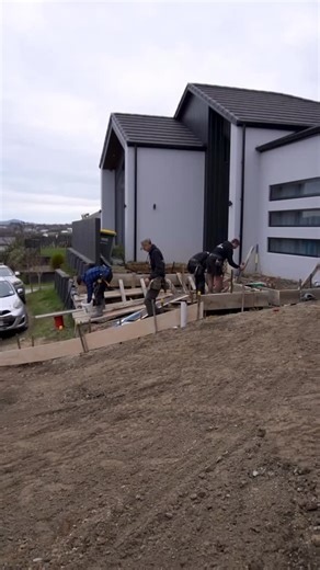 Watch this transformation as we take a steep site and install an exposed aggregate driveway. Finished with an acid wash and a natural look sealer, the result is a sleek, non-slip surface that looks just as good as it functions. And we are not done yet! Stage two, we will be adding floating concrete steps leading to the front door, the perfect finishing touch to this standout entrance. #totalconcretesolutions @firth_ecomix | Total Concrete Solutions