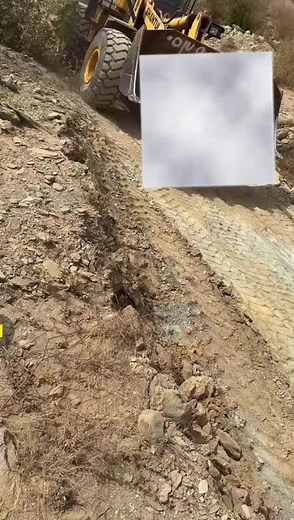 Massive Front Loader Creates Trench in Rocky Terrain