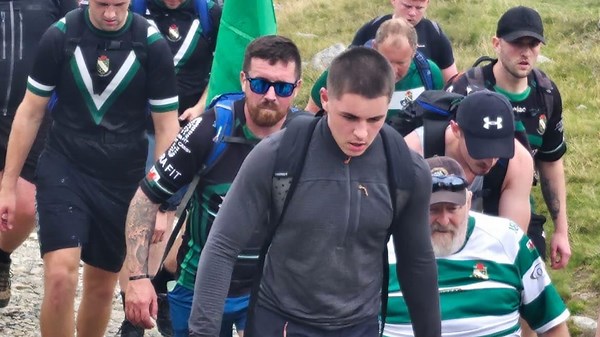 Rugby team carries wheelchair-bound dad up mountain - fulfilling lifelong dream