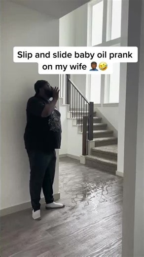 Wife slips on baby oil prank!