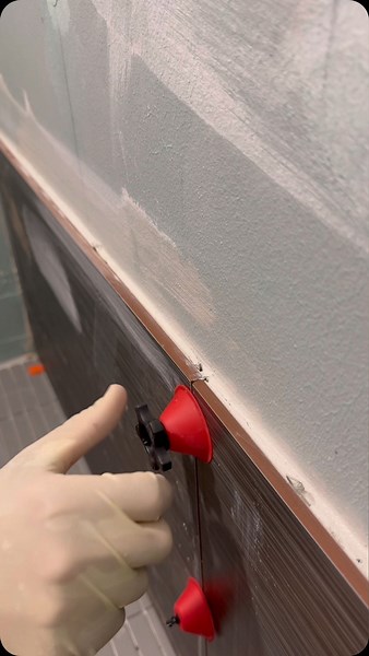 A Blank Canvas on Instagram: "Part one of this shower! Large Format Tile. Check out this friction free lippage tuning system by @thetiledoctor avoid the risk of scratching the face of your tile surface or causing your tile to shift. Get 10% off any order using code Tylor10 . free shipping for orders over $50.00! at designtile.com more information and instructional videos for these coming soon!"