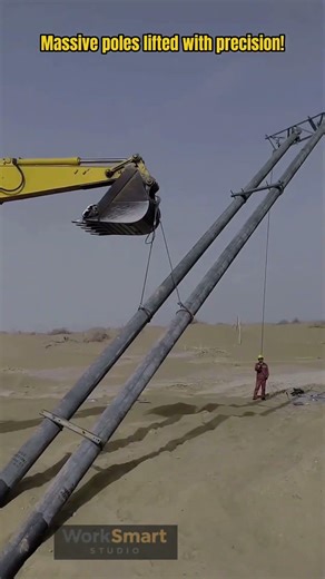Heavy Utility Pole Installation by Excavator Operator : Lifting and Positioning Process