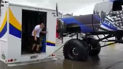 Monster truck driver rescues stranded vehicle