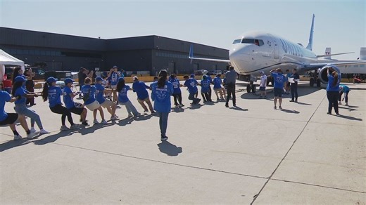 Teams pull 82-ton cargo plane at Dulles Airport to support Special Olympics Virginia