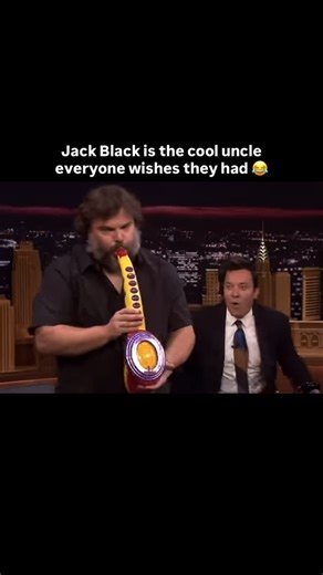 Book Reviews, Previews & More on Instagram: "Jack Black takes the stage on a 2018 episode of The Tonight Show and somehow turns a toy Sax-A-Boom into a full concert moment. Supported by The Roots house band, he plays with full showmanship, hitting dramatic notes and engaging the audience as if he’s performing in a sold-out arena!🎷🎶😂❤️ Credit: The Tonight Show Show Starring Jimmy Fallon (2018) #JackBlack #TonightShow #JimmyFallon #Comedy #Iconic Funny Talk Show Legendary Performance Viral Reel