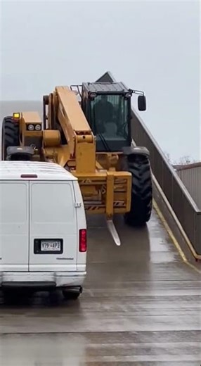 Runaway Heavy Telehandler Pushes Delivery Van Down Wet Industrial Ramp