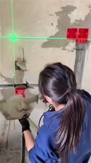 Using a green laser level to mark precise electrical box positions on a wall