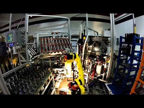 Automated Press Assembly Machine with Robotic Transfer for Geared Shafts - Compass Automation