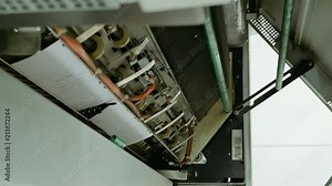 Printing and folding machine for big size drawing and draft printing. Design office supply equipment. Vertical format video.