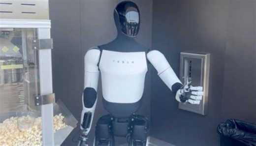 Tesla humanoid robot goes viral for serving popcorn