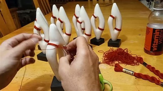 Red thread versus white marble, on black slates, symbols garble, words as knots to ne'er untie, all held fast as Fortune's nigh | The Church of Dust