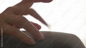 Nervous woman finger tapping on leg close-up 4K 2160p UHD video - Impatiently tapping with fingers on leg 4K 3840X2160 UHD footage