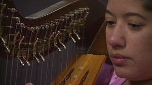 Watch: New Berlin woman attempts to break world record for marathon harp playing