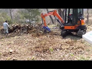 迫力の抜根（重機は力持ち）