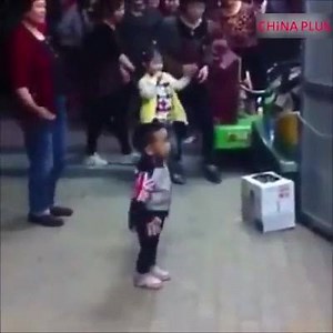 This kid is engrossed in his little dancing world, showing off his square dancing skills in front of grannies. | China Plus South Africa