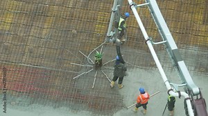 building a floor by pumping liquid concrete for Concreting on a construction site
