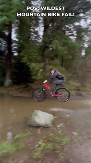 This mountain biker hits a deep puddle!