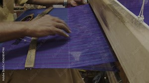 Traditional weaving technique in an old and colourful weaving shop