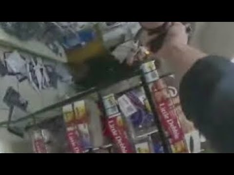 Video shows Dallas police shooting armed man inside convenience store