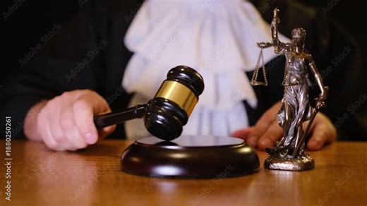 Judge hitting gavel in courtroom for justice and law