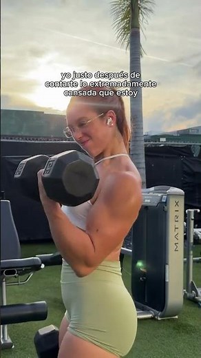 Cute female bodybuilder flexing
