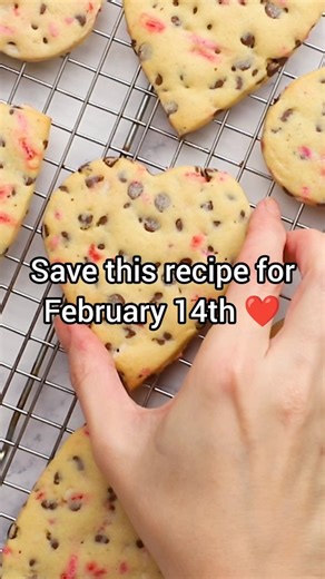 The Toasty Kitchen on Instagram: "Heart shaped chocolate chip cookies are the perfect homemade treat for Valentine's Day - easy to share OR keep for yourself 😉 These soft cookies hold their shape beautifully when baked and are filled with plenty of mini chocolate chips and festive sprinkles. Full recipe linked in bio: https://thetoastykitchen.com/heart-shaped-chocolate-chip-cookies/ #recipeblog #easyrecipes #valentinesday❤️ #valentine #valentinecookies"
