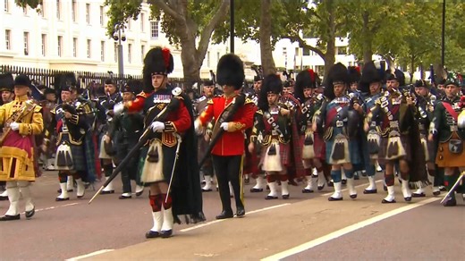 The Massed Pipes and Drums and Royal Navy Sailors depart Wellington Barracks on the morning of the Queen’s funeral. | The Royal Family Channel