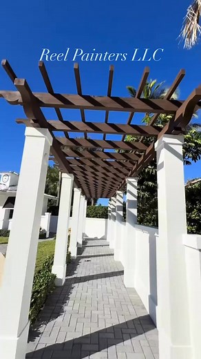 Stunning Wood Refinish & Exterior Painting Upgrade ✨ Complete Exterior Refresh at the Jupiter Inlet Colony Security Entrance! ✨ Check out this beautiful transformation! We refinished the front-entry pergola using Sherwin-Williams WoodScapes Rain Refresh solid stain — designed for long-lasting protection against Florida’s sun, salt air, and humidity. 🌴☀️🌊 But we didn’t stop there… We also completed a full exterior repaint of the walls, columns, and the security building, giving the entire entra