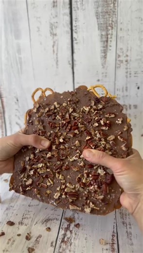 Salted pretzel pecan toffee bark Our toffee bark has a Salted pretzel base topped with a buttery rich caramel garnished with toasted pecans and a sprinkle of sea salt flakes . #toffeebark #pecans #buttery #sweattreat #caramel #seasalt #saltedcaramel