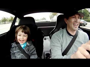 My boy laughing in the Porsche on the way to school..