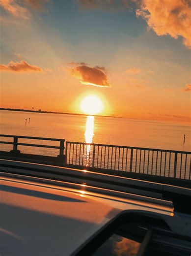 Gorgeous sunset vibes while driving over the Navarre Beach Causeway 🌅 Sky on fire, calm waters, and that golden-hour glow you only get here. Slow down and soak it in. ✨ Stay for the view 📍 Navarre Beach, Florida ❤️ Follow for more peaceful coastal drives #NavarreBeach #NavarreBeachCauseway #FloridaSunset #SunsetDrive #CoastalVibes