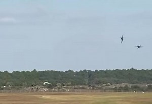 The Fortus maneuver by the Blue Angel Solos ! Both enter the aerobatic box "dirty", (landing gear down) at 200ft and 315 mph. #5 rolls to inverted and 6 pulls up alongside to create a mirror image at centerpoint. They both then begin to climb, #5 rolls upright and both exit behind the crowd, left, at about 1000'. . . . . Please note that this page is not directly affiliated with the Blue Angels. This page is run by a team of friends who happen to enjoy studying them and keeping track of what the